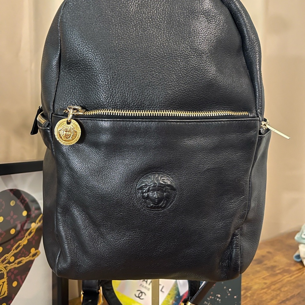 Versace Black Leather Backpack with Gold Medusa Charm.